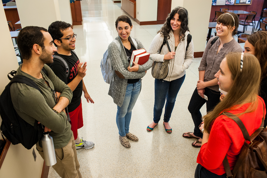 Students talking in law school hallway