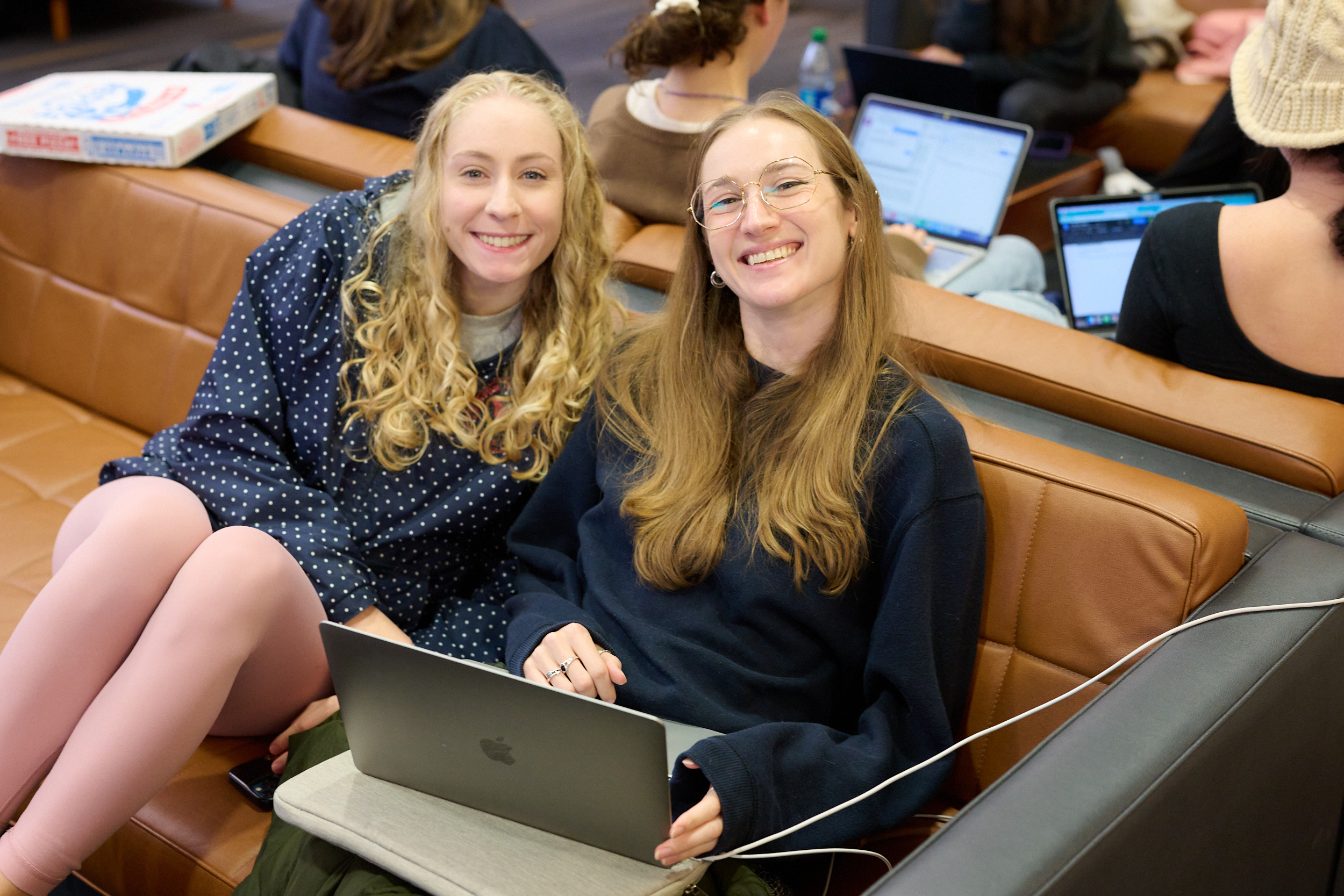 Two students posing for photo in Kelly Lounge