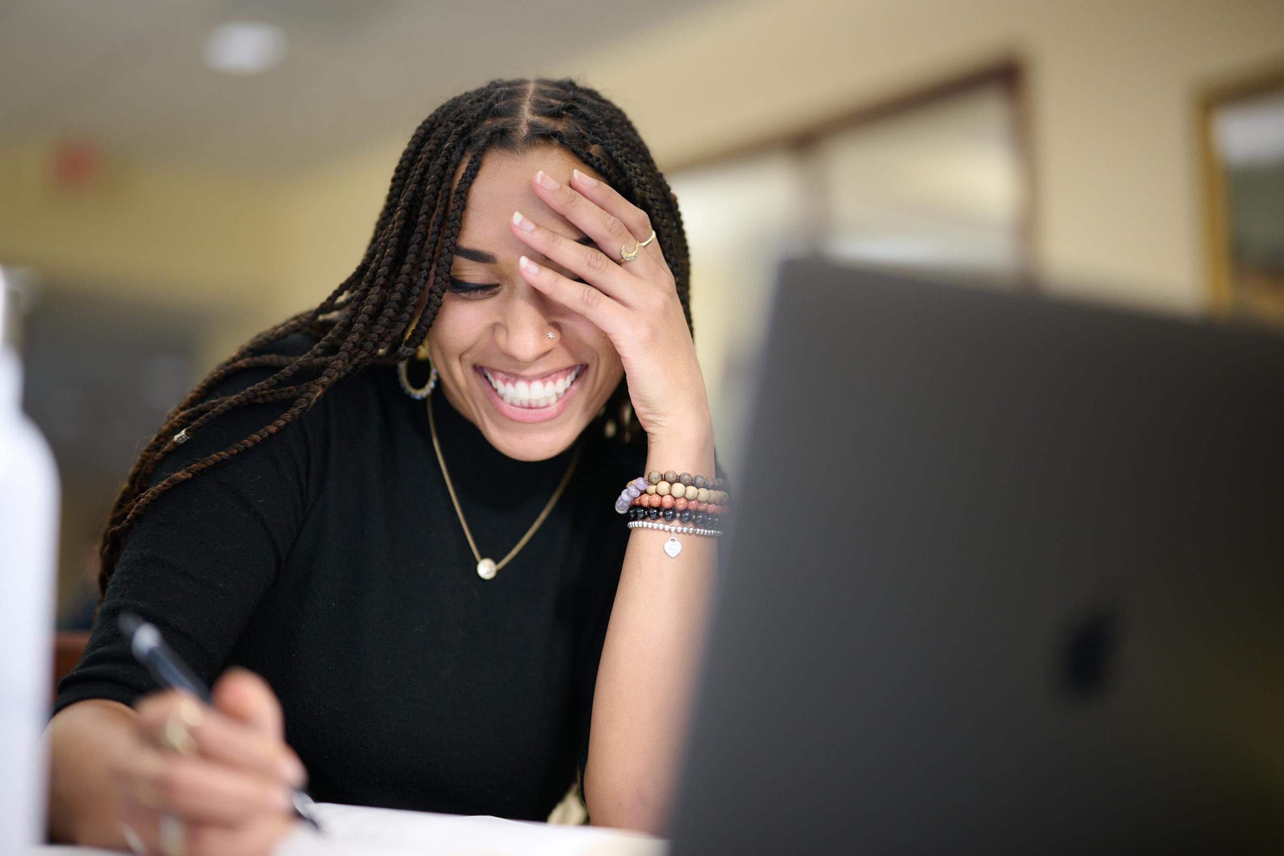 Student smiling and studying